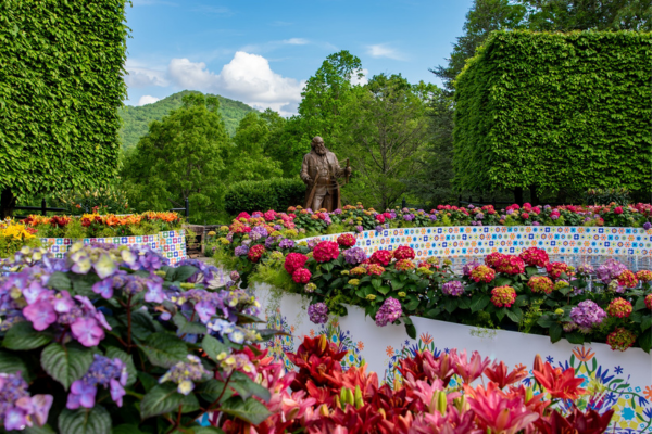 A statue of Frederick Olmstead in the flower garden at the NC Arboretum in Asheville, NC